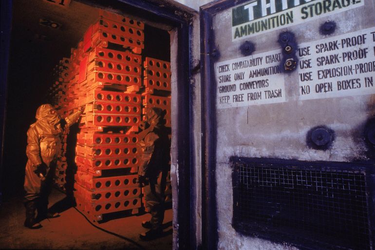 256684 16: A worker in protective clothing stands in a special storage area filled with M-55 rockets armed with sarin gas, a nerve agent, at an incinerator June 12, 1995 at the Tooele Army Depot, in Tooele, Utah as part of a government project to destroy the nation's toxic arsenal. The Tooele site, 25 miles from Salt Lake City, houses approximately 40% of the U.S.'s chemical weapons, stored in 208 warehouses on the premises. (Photo by Remi Benali/Getty Images)