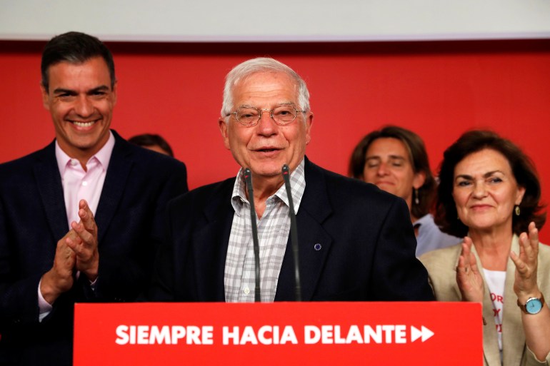 Socialist party (PSOE) candidate for European elections Josep Borrell addresses the media as Spanish acting Prime Minister Pedro Sanchez claps following election results at the party headquarters in Madrid, Spain, May 27, 2019. REUTERS/Susana Vera