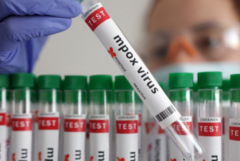 FILE PHOTO: A test tube labelled "Mpox virus positive" is held in this illustration taken August 20, 2024. REUTERS/Dado Ruvic/Illustration/File Photo