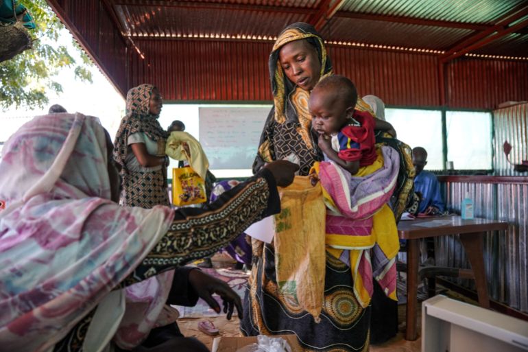 FILE PHOTO: Handout photograph of a woman and baby at the Zamzam displacement camp in North DarfurFILE PHOTO: A handout photograph, shot in January 2024, shows a woman and baby at the Zamzam displacement camp, close to El Fasher in North Darfur, Sudan. An assessment by Medecins Sans Frontieres (Doctors Without Borders) in January found that at the camp, which is home to an estimated 400,000 people, two babies were dying every hour. Nearly 40% of children aged six months to two years old were malnourished, the group found. MSF/Mohamed Zakaria/Handout via REUTERS THIS IMAGE HAS BEEN SUPPLIED BY A THIRD PARTY. MANDATORY CREDIT/File Photo DATE 15/08/2024 SIZE 3500 x 2333 Country SUDAN SOURCE REUTERS/Mohamed Zakaria