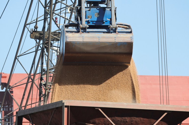 A machinery loads wheat into a truck at Beirut's port, Lebanon, February 17, 2023. REUTERS/Mohamed Azakir