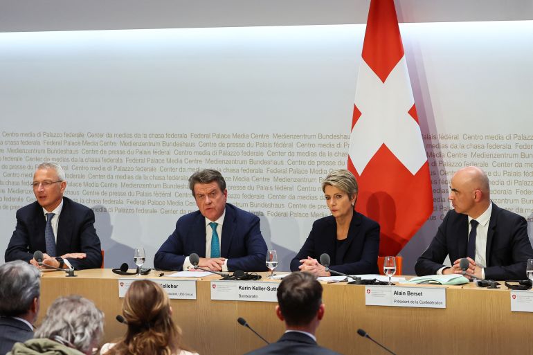 Chairman of the Board of Directors of Credit Suisse, Axel Lehmann, Chairman of the Board of Directors of UBS, Colm Kelleher, Federal Councillor and chief of the finance federal department Karin Keller-Sutter, and Swiss Federal Council (Bundesrat) President and chief of the interior federal department, Alain Berset attend a news conference on Credit Suisse after UBS takeover offer, in Bern, Switzerland, March 19, 2023. REUTERS/Denis Balibouse