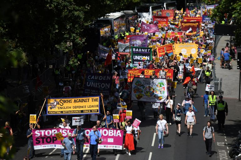 Counter-protesters take part in a protest against Tommy Robinson, during a march organised by Stand Up To Racism and other groups, in London, Britain, July 27, 2024. REUTERS/Chris J Ratcliffe