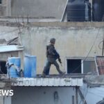 Israel investigates after its soldiers filmed throwing bodies off roof