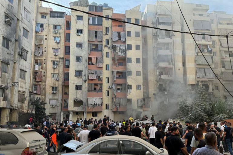 people inspect the site of an israeli strike in the southern suburbs of beirut, lebanon, september 20, 2024. reuters/mohamed azakir