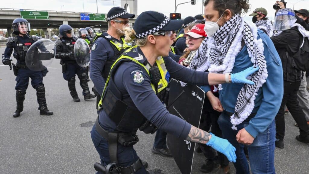 Anti-war protesters clash with police outside Australian arms convention