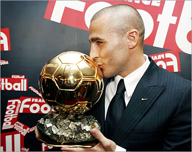 reuters/ italy's soccer player fabio cannavaro of real madrid kisses his ballon d'or (golden ball) award as european footballer of the year during a news conference in paris november 27,