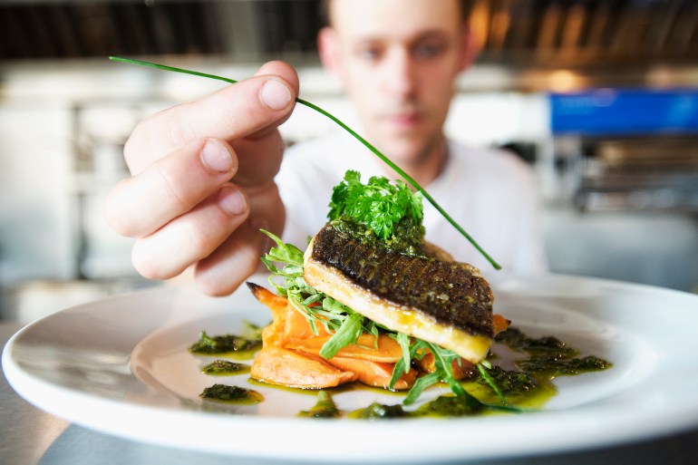 Chefs doing kitchen preparation and service