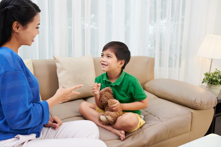 little vietnamese boy enjoying playing with his mother المصدر : إنفاتو