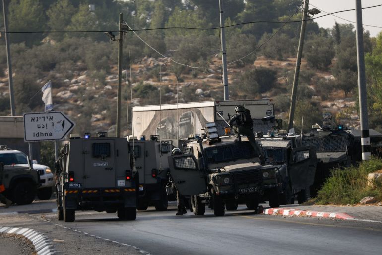 Israeli forces patrol near a shooting scene, near Hebron in the Israeli-occupied West Bank September 1, 2024. REUTERS/Yosri Aljamal