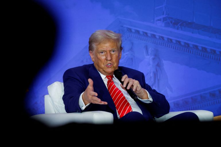 Republican presidential nominee and former U.S. President Donald Trump participates in a fireside chat during the Moms for Liberty National "Joyful Warriors" Summit, in Washington, U.S., August 30, 2024. REUTERS/Evelyn Hockstein