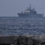 First Italian ship with 16 intercepted migrants docks at Albanian port to process asylum request